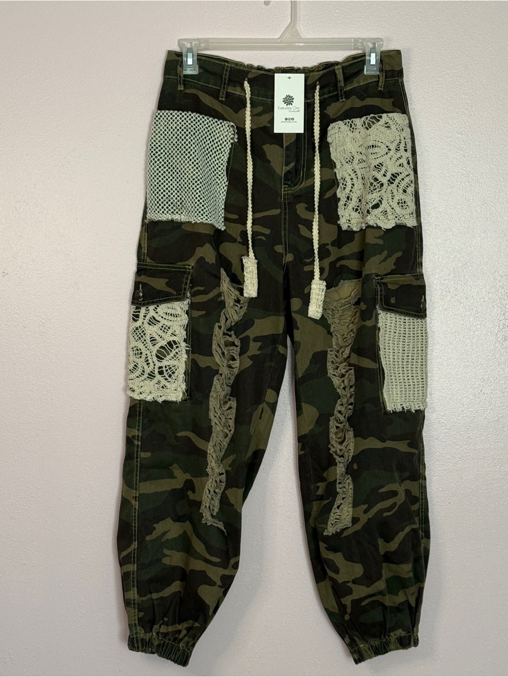 NWT, size adult M camouflage distressed cargo joggers with crocheted accents